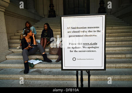 New York, NY, US, October 1, 2013; People on steps of National Museum of the American Indian next to sign noting closure of all Smithsonian museums due to the partial federal government shutdown. Credit:  Joseph Reid/Alamy Live News Stock Photo