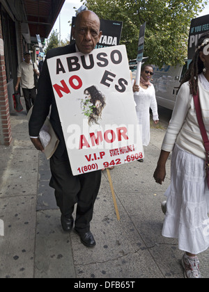 13th Annual Gladys Ricart and Victims of Domestic Violence Memorial Walk, Brides' March, 2013. Sign reads, 'Abuse is not love.' Stock Photo