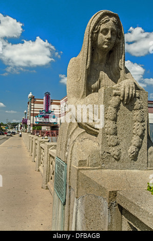 Statue on the Aurora Memorial Bridge Aurora Illinois and Hollywood Casino in the background Stock Photo