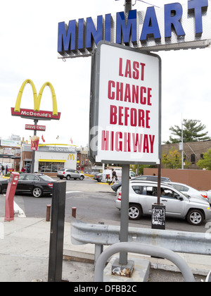 Sign and fast food restaurants near highway in The Bronx, NY, 2013. Stock Photo