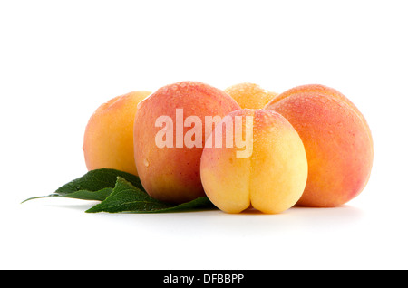 Sweet peaches with leafs on a white background Stock Photo