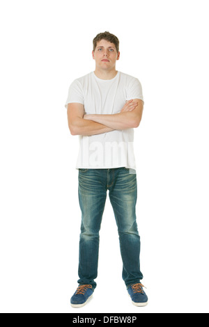 Young man standing with arms crossed Stock Photo