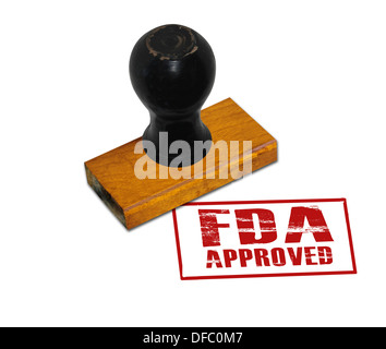 An office rubber stamp with text 'FDA Approved' punched in red Stock Photo