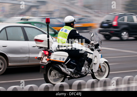 Chinese policeman on motorbike in Beijing, China Stock Photo