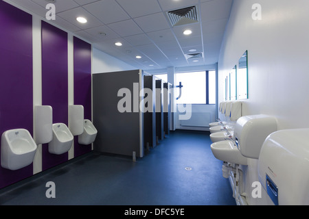 Unoccupied male public toilets in commercial building. Stock Photo