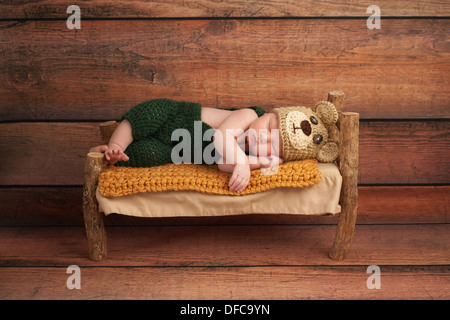 Newborn Baby Boy in a Teddy Bear Costume Stock Photo