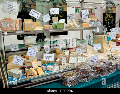 Cakes cake and Cheese Cheeses market stall display counter at the Annual Food And Drink Festival Parliament Street York North Yorkshire England UK Stock Photo