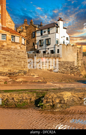 Bay Hotel Pub, village & beach of historic fishing village of Robin Hood's Bay, Near Whitby, North Yorkshire, England. Stock Photo