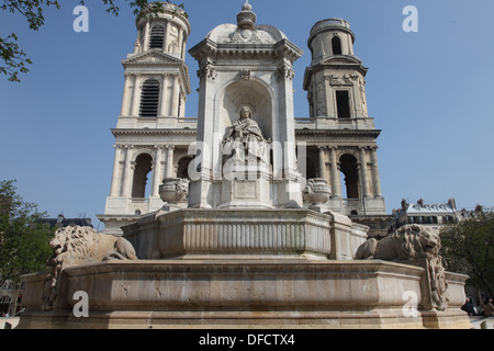 Geometrical view: the Saint Sulpice fountain with its church on the background. One bell-tower is more advanced than the other. Stock Photo