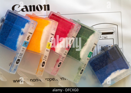 Used empty Canon ink cartridges on envelope to return for recycling after printing using home computer and inkjet printer Stock Photo