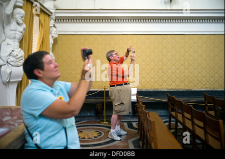 Tourists take pictures inside the Oratorio del Rosario di Santa Cita. Palermo, Italy Stock Photo