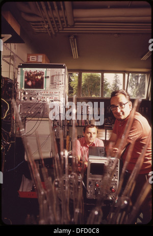 Dr. Velimir Pravdic, the Chief of the Electro-Chemistry Lab, is pictured with his assistant, Marijan Vukovic, in the lab. They are working on research in the field of electro-chemistry. Stock Photo
