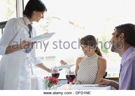 https://l450v.alamy.com/450v/dfd1ne/waitress-serving-food-to-couple-in-restaurant-dfd1ne.jpg