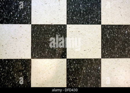 Black and white marble tiled checkerboard floor tiling Stock Photo