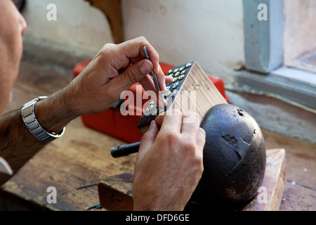 Jeweler working at his bench in Toledo, Spain. Stock Photo