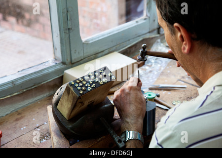 Jeweler working at his bench in Toledo, Spain. Stock Photo