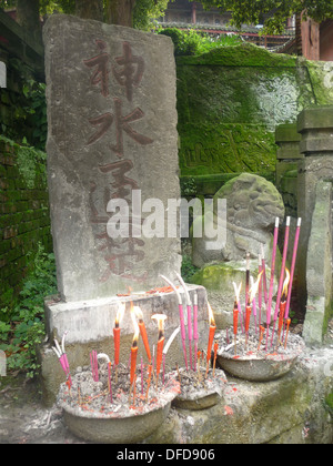 A stone statue at the entrance to a temple on Mount Emei, in Sichuan Province near Chengdu, China Stock Photo