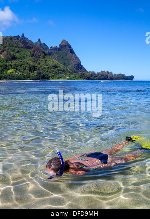 Snorkeler at Tunnels Beach on Kauai, with Mt. Makana, called Bali Hai, in the distance Stock Photo