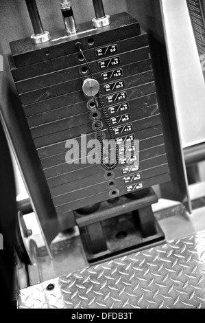 Black and white image of the weight or resistance selector on professional exercise equipment at a commercial gym Stock Photo