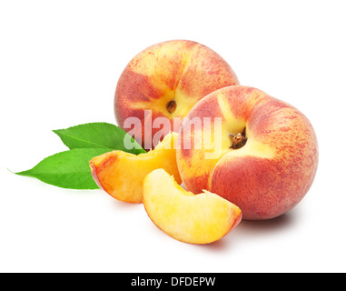 Ripe peach fruit with leaves and slises on white background Stock Photo