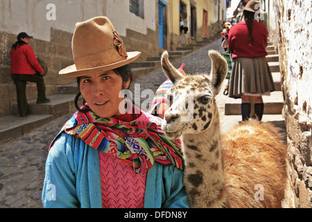 Quechua Indian girl with baby llama (cria), Cuzco, Peru Stock Photo - Alamy