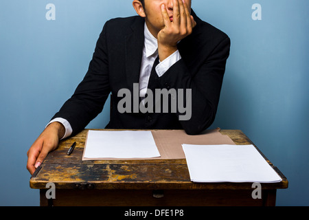 Young businessman is bored Stock Photo
