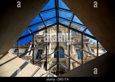 Part of the Louvre seen from the inside of the Glass Pyramid, Paris, France Stock Photo