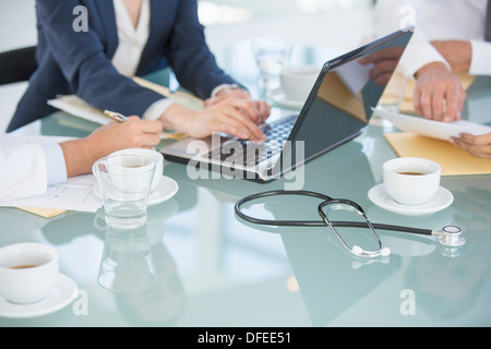 Business people and doctors in meeting Stock Photo