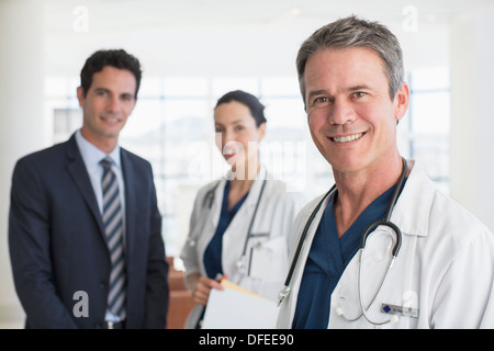 Portrait of smiling doctors and businessman Stock Photo