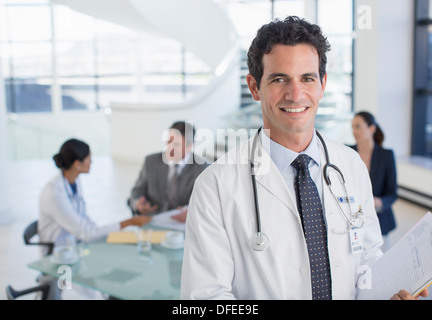 Portrait of smiling doctor in meeting Stock Photo