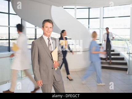Portrait of smiling businessman in hospital Stock Photo