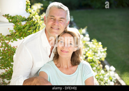 Portrait of smiling senior couple in garden Stock Photo