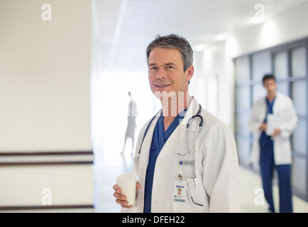 Doctor smiling in hospital Stock Photo