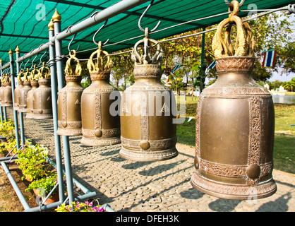 Old bells in a buddhist temple of Thailand. Stock Photo