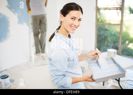 Couple painting wall blue Stock Photo