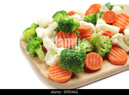 Different frozen vegetables on a cutting board Stock Photo