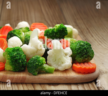 Different vegetables frozen on a cutting board Stock Photo
