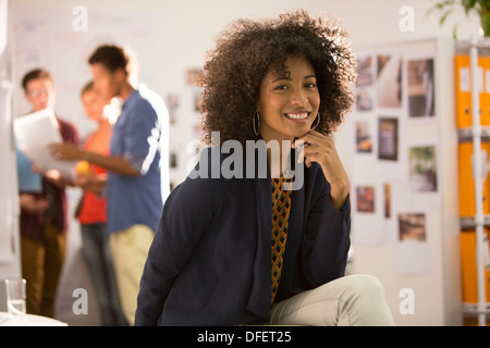 Portrait of smiling businesswoman in office Stock Photo