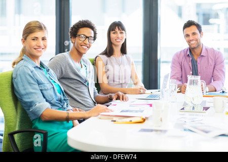 Portrait of smiling business people in office Stock Photo