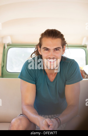 Portrait of smiling man in van Stock Photo