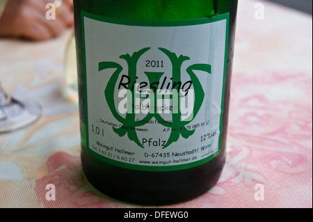A bottle of Riesling wine from the Pfalz region made by Weingut Hellmer on a restaurant table Stock Photo