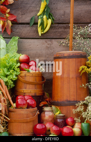 Antique butter churn and shaker handmade wooden boxes with apples and apple butter on display at a farmers market, Vermont USA Stock Photo