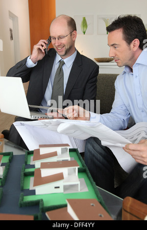 Two architect rushing to complete on time Stock Photo