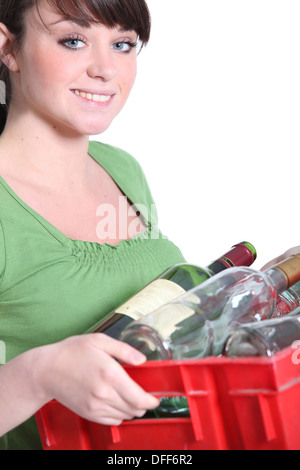 Woman taking out the recycling Stock Photo