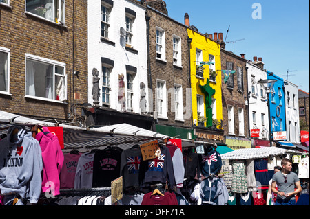 Tourists walk past stalls and shops in Inverness St in Camden, London on August 21, 2013. Once a fresh prod Stock Photo