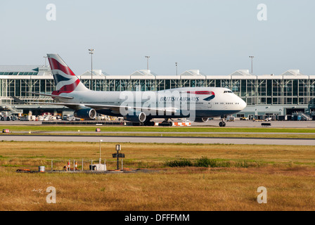 British Airways Boeing 747-436 taxiing down runway at YVR, Vancouver International Airport.