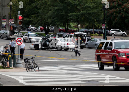 Washington, DC, USA. 3rd Oct, 2013:  US Secret Service and Capitol Police chase a woman who tried to ram security gate at the White House with her car.  A car chase ensues from the White House to the US Capitol building.  The chase ends in a crash, shots are fired by Capitol Police.  The woman driver is confirmed dead, a Capitol Policeman is injured. © B Christopher/Alamy Live News Stock Photo