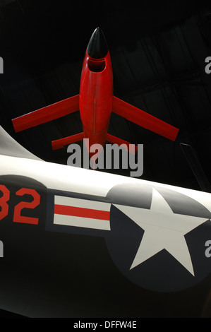 A fire bee drone flies over the tail of a air force bomber at the US Air Force Museum in Dayton Ohio Stock Photo