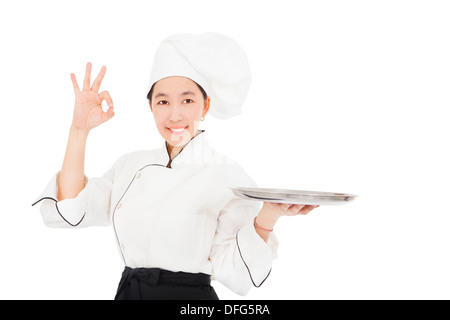 smiling young woman chef with empty food tray Stock Photo