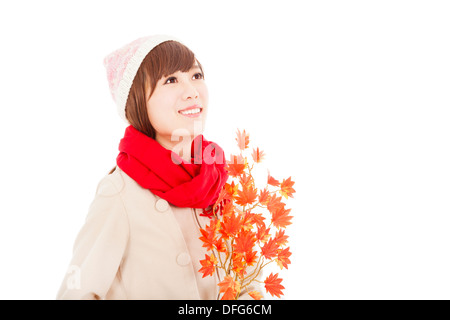 young smiling woman with yellow maple leaf Stock Photo